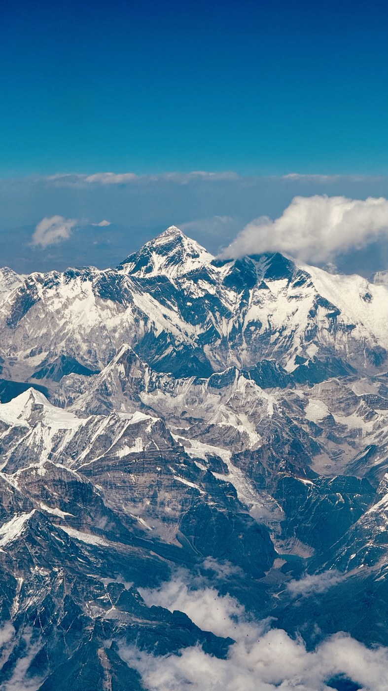 Close aerial view of Mount Everest and surrounding Himalayan peaks